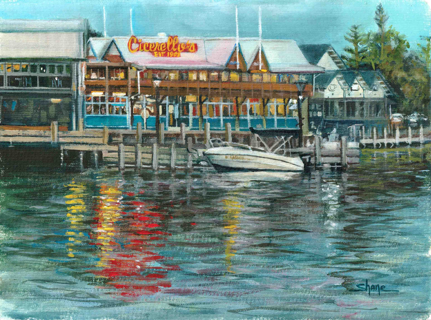 Boat moored in front of Cicerellos on Mandurah Foreshore. Cicerello's lights reflecting in the water.